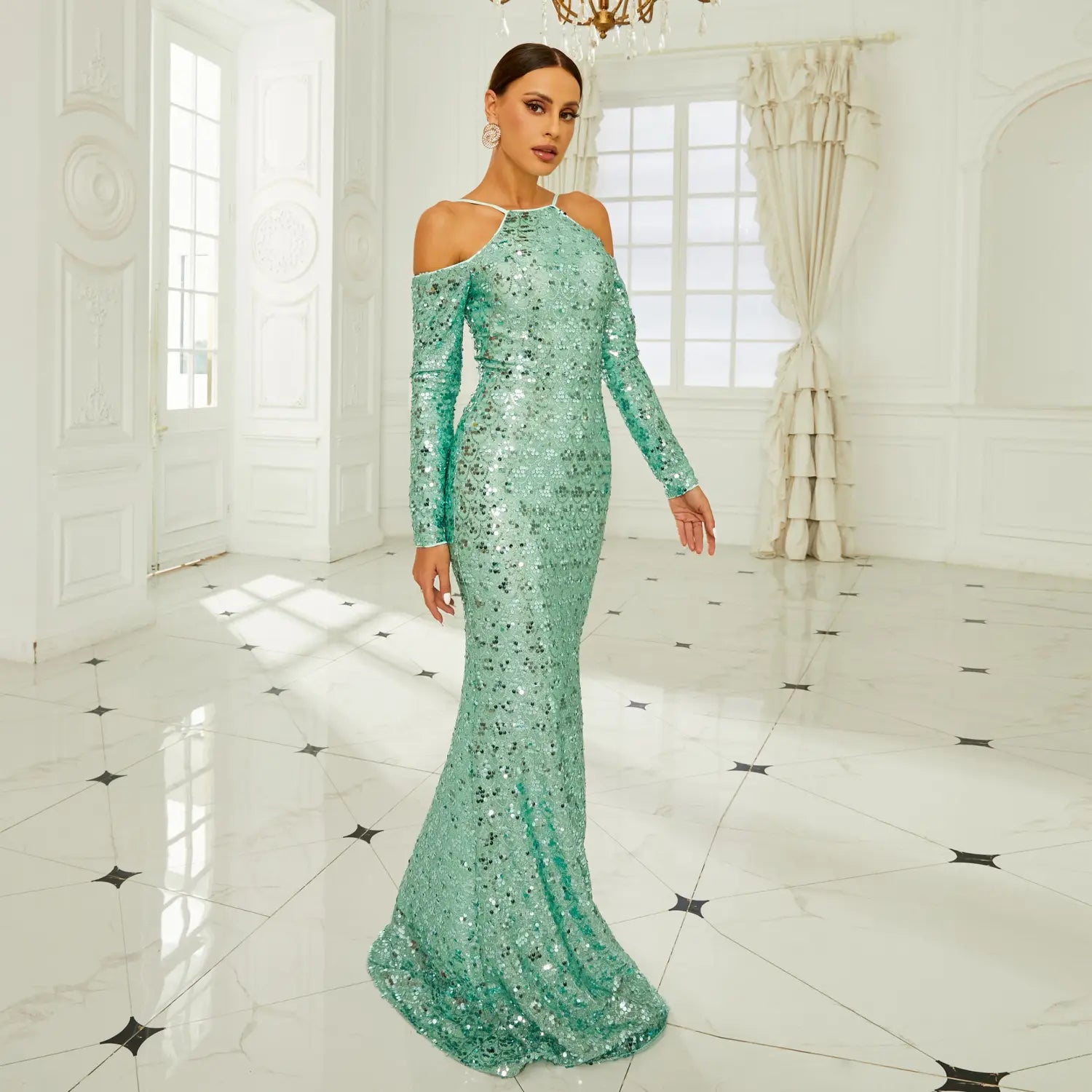 A shimmering mint green long sleeve banquet sequined sheath fishtail dress with an off the shoulder neckline.