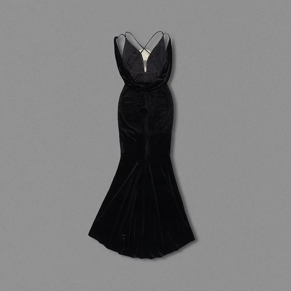 Elegant black camisole backless slim fit velvet floral gown featuring a plunging neckline and delicate crisscross straps in a mermaid silhouette.