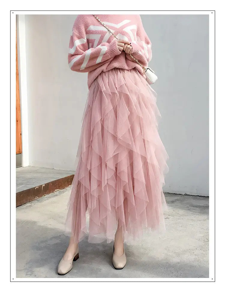 a flowing layered pink tulle skirt with soft airy texture and gentle ruffles featuring easy matching mesh stitching for a stylish matching mesh stitching skirt.