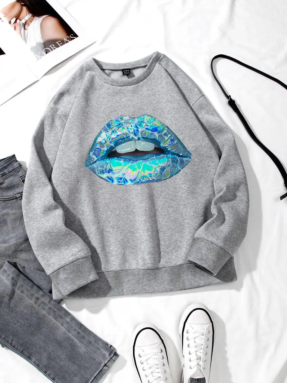 women’s gray crew neck long sleeve sweatshirt featuring a vibrant iridescent blue and teal lips graphic