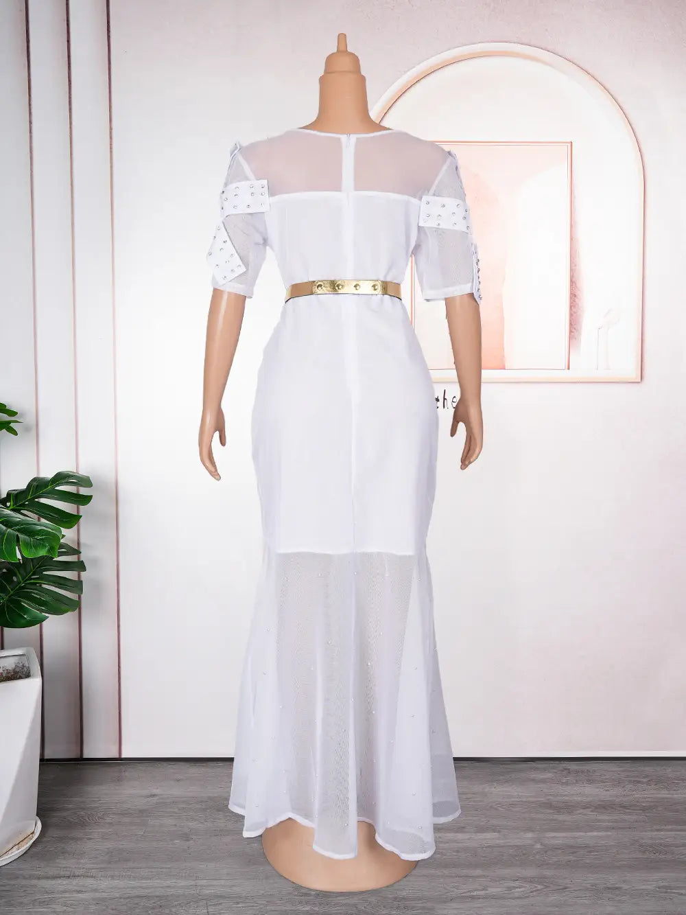 royal blue heavy embroidered hot diamond beads gown featuring a white sheer mesh dress with short flutter sleeves and a gold belt.