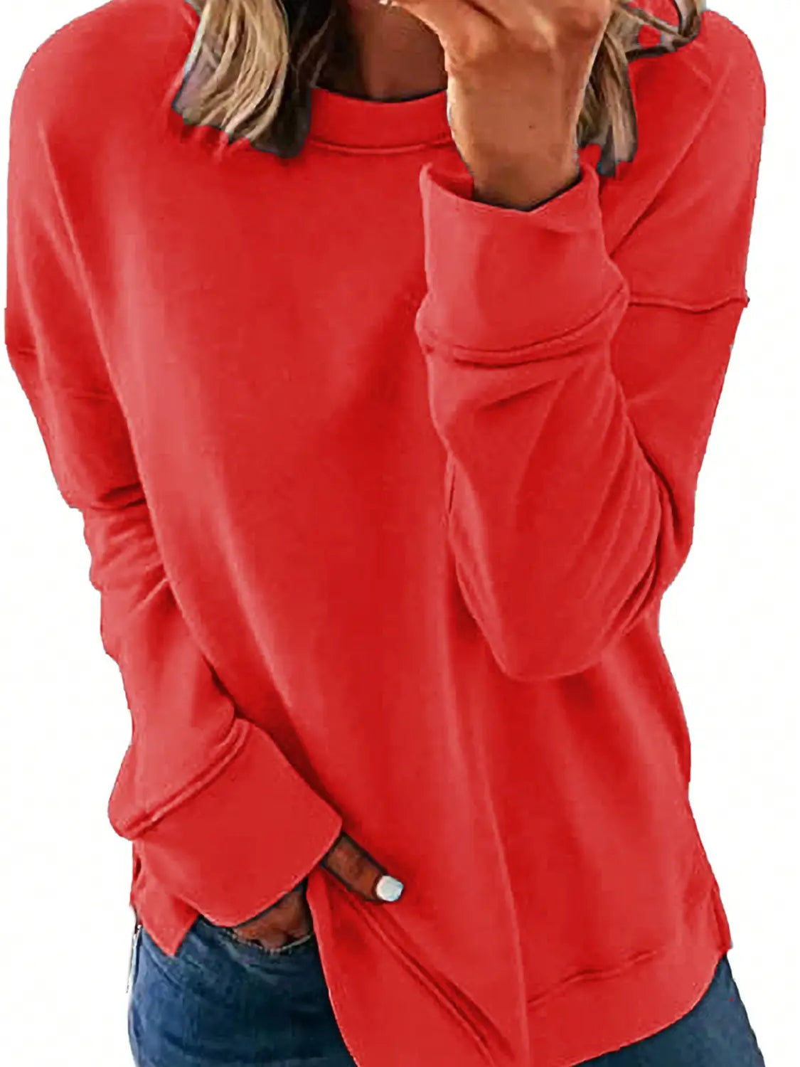 A vibrant red long sleeve sweatshirt with a relaxed fit and ribbed cuffs ideal for womens sweatshirts fall fashion.