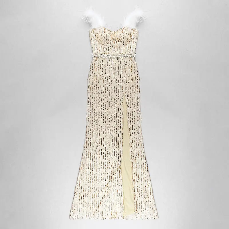 a shimmering champagne-colored feather raglan large slit mermaid-style evening dress adorned with intricate black sequin patterns and delicate white feather accents at the straps