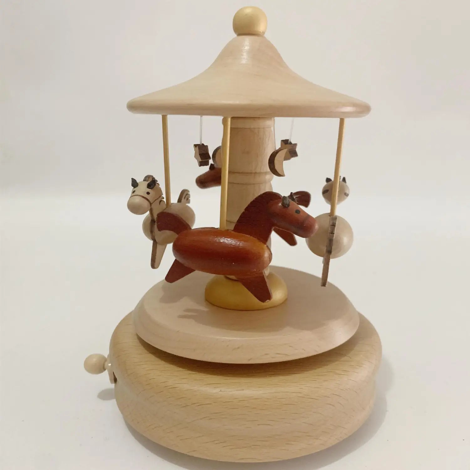 A wooden diy dancing music box featuring carved natural wood horses with one prominent reddish-brown horse on a light-colored base.