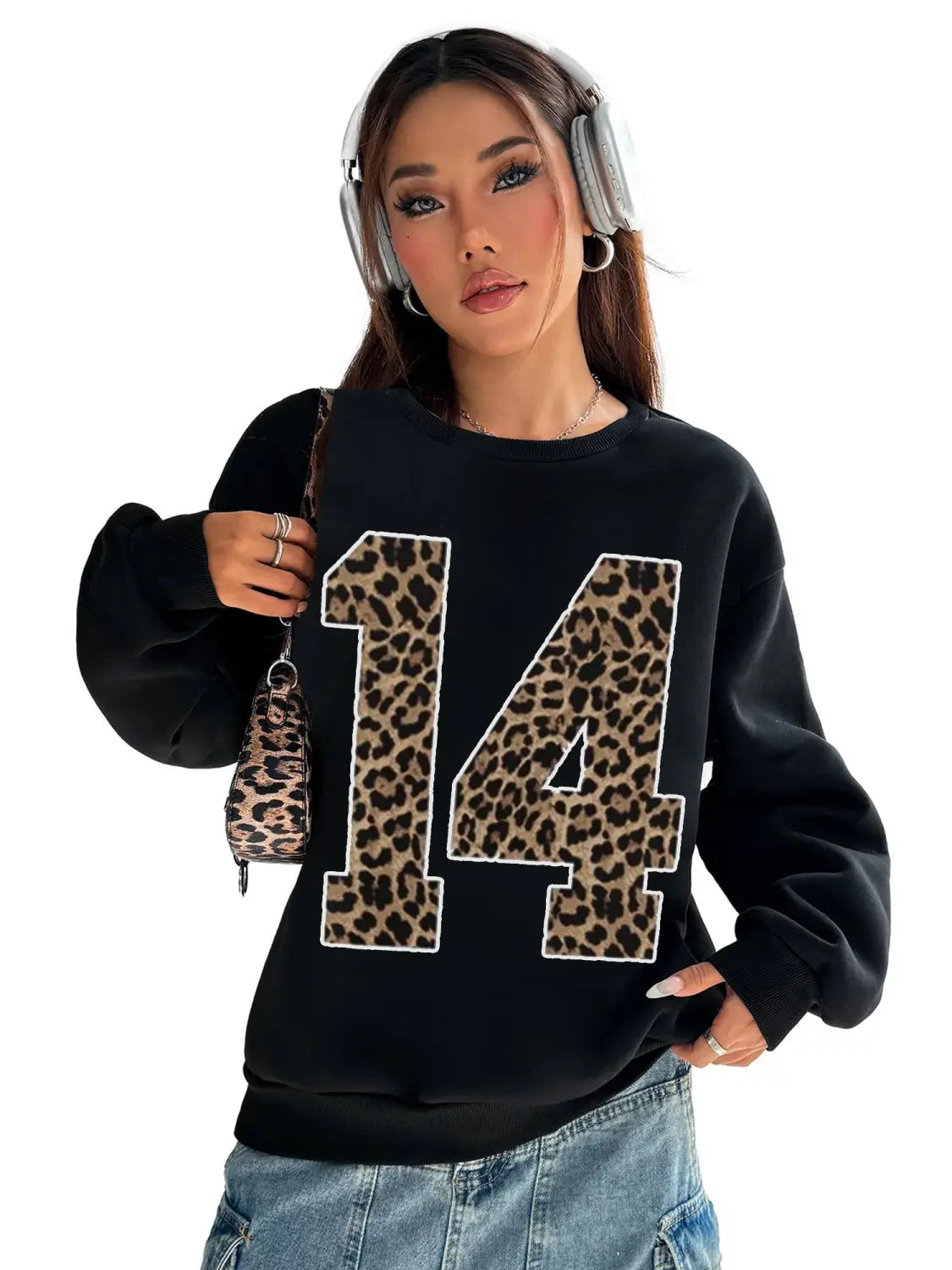 Black crew neck sweatshirt featuring a bold leopard print number 14 on the front.
