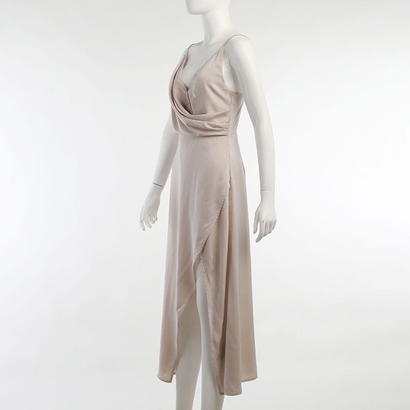 A flowing beige satin midi slit sling dress with a draped v-neckline and side slit ideal for dress summer fashion.