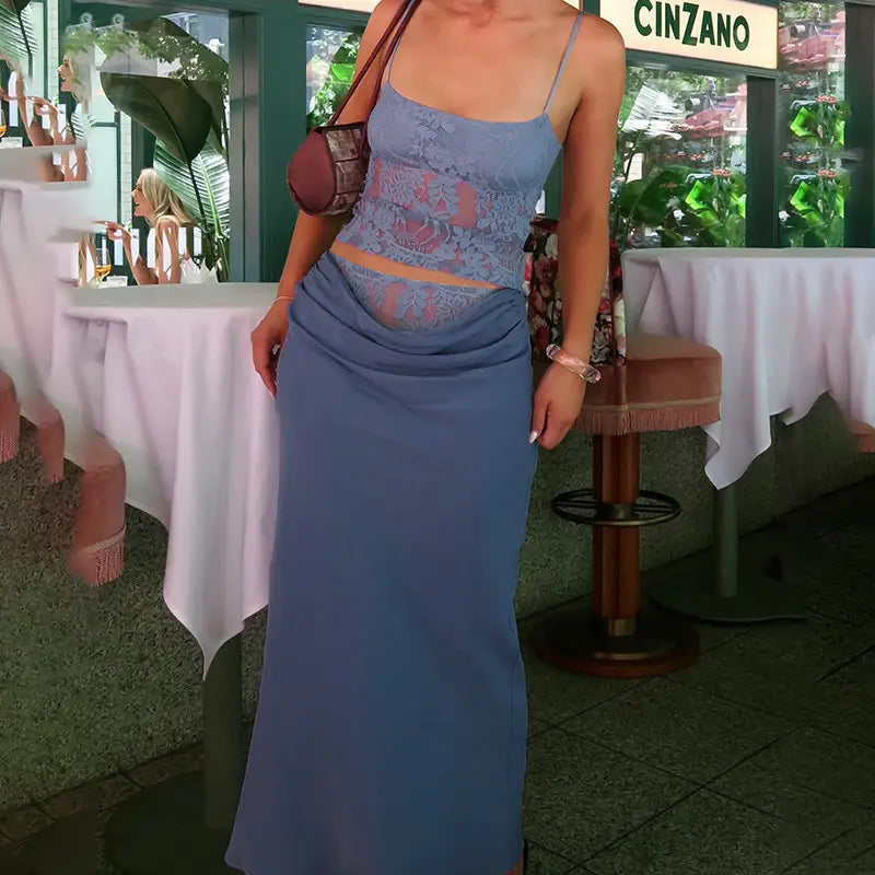 a light blue two-piece outfit featuring a lace backless tube top with thin straps and a flowing skirt with sling stitching ruffle detailing and stitching ruffle hip design
