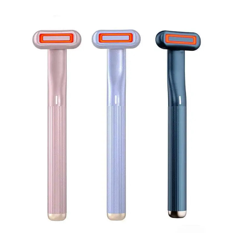A sleek translucent pink rose gold 5-in-1 rotary eye massage wand with red led light and therapeutic warmth features