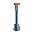 Blue rotary eye massage handpiece with therapeutic warmth and orange light in a rose gold 5-in-1 base