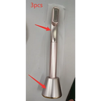 Silver-toned metal rotary eye massage key fob with sleek cylindrical body and textured grip for therapeutic warmth use