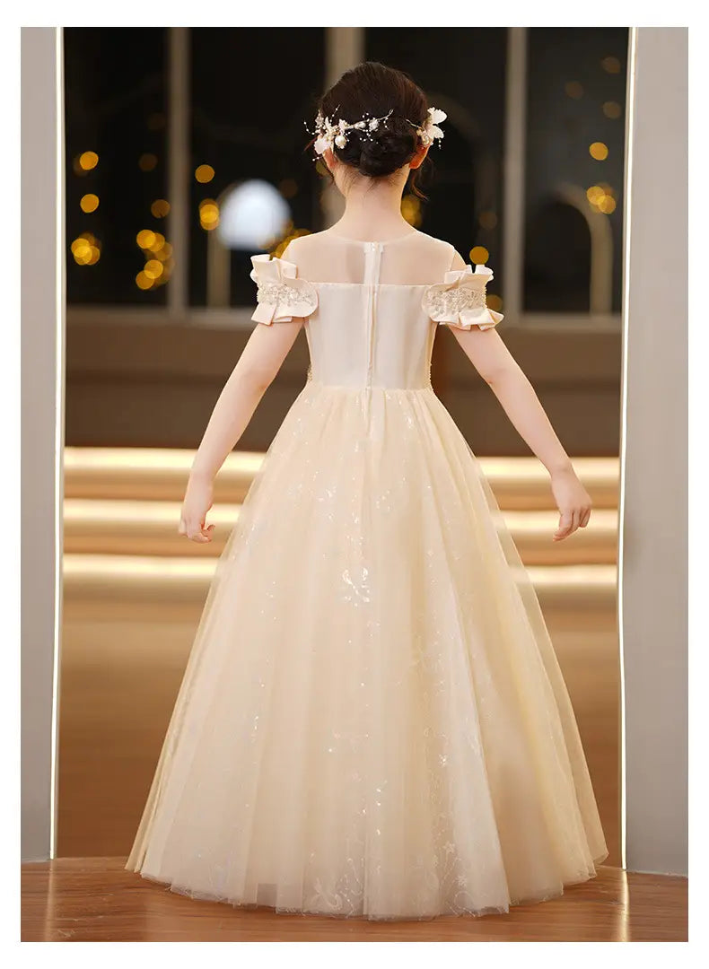 A delicate off-the-shoulder ivory tulle spandex princess dress for girls featuring lace ruffled sleeves and a sparkling bodice, ideal as a girls tulle tutu.