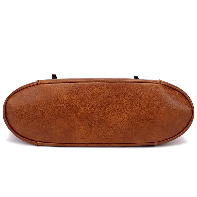 Brown faux leather large capacity luxury women leather crossbody hobo bag with a textured slightly cracked surface and rounded edges.