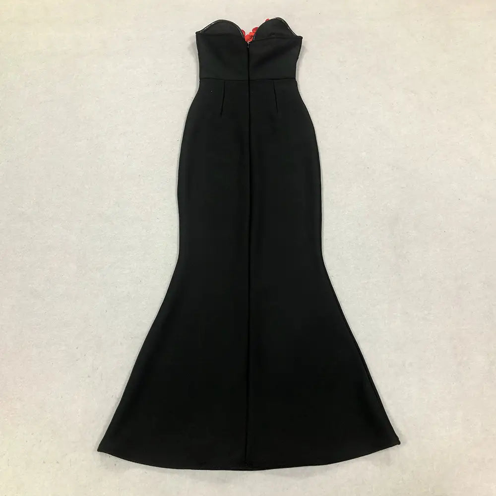 black strapless mermaid gown with fitted bodice and flared skirt featuring subtle pleats down the front from the white temperament socialite flower chain evening dress collection.