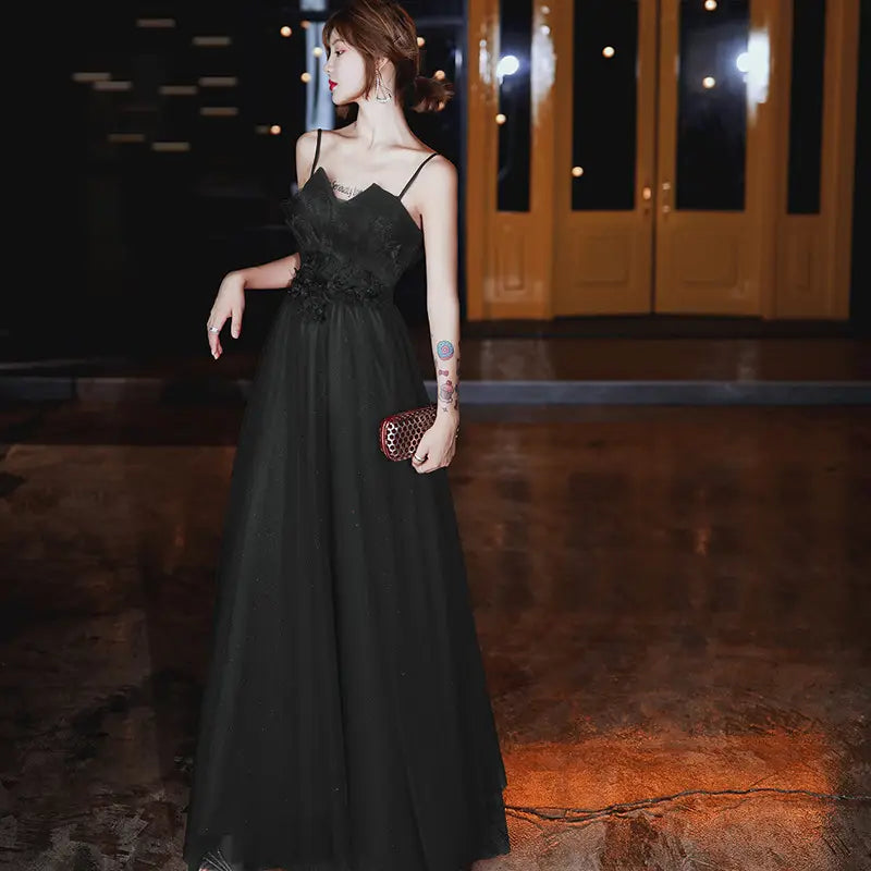 Black lace bodice and tulle skirt evening dress with thin spaghetti straps designed to wear engagement suspender in an elegant engagement suspender evening style.