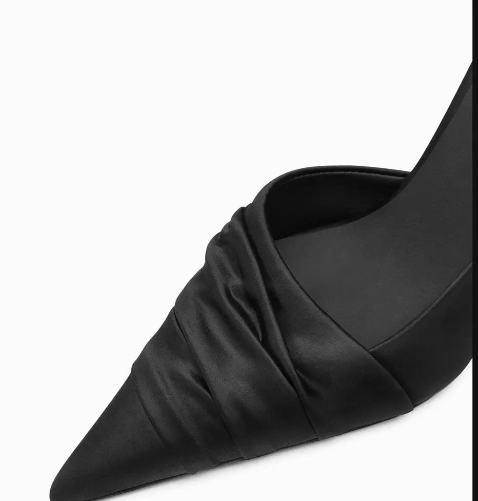 Black cloth satin high heels with a pointed toe and elegant ruched detailing.