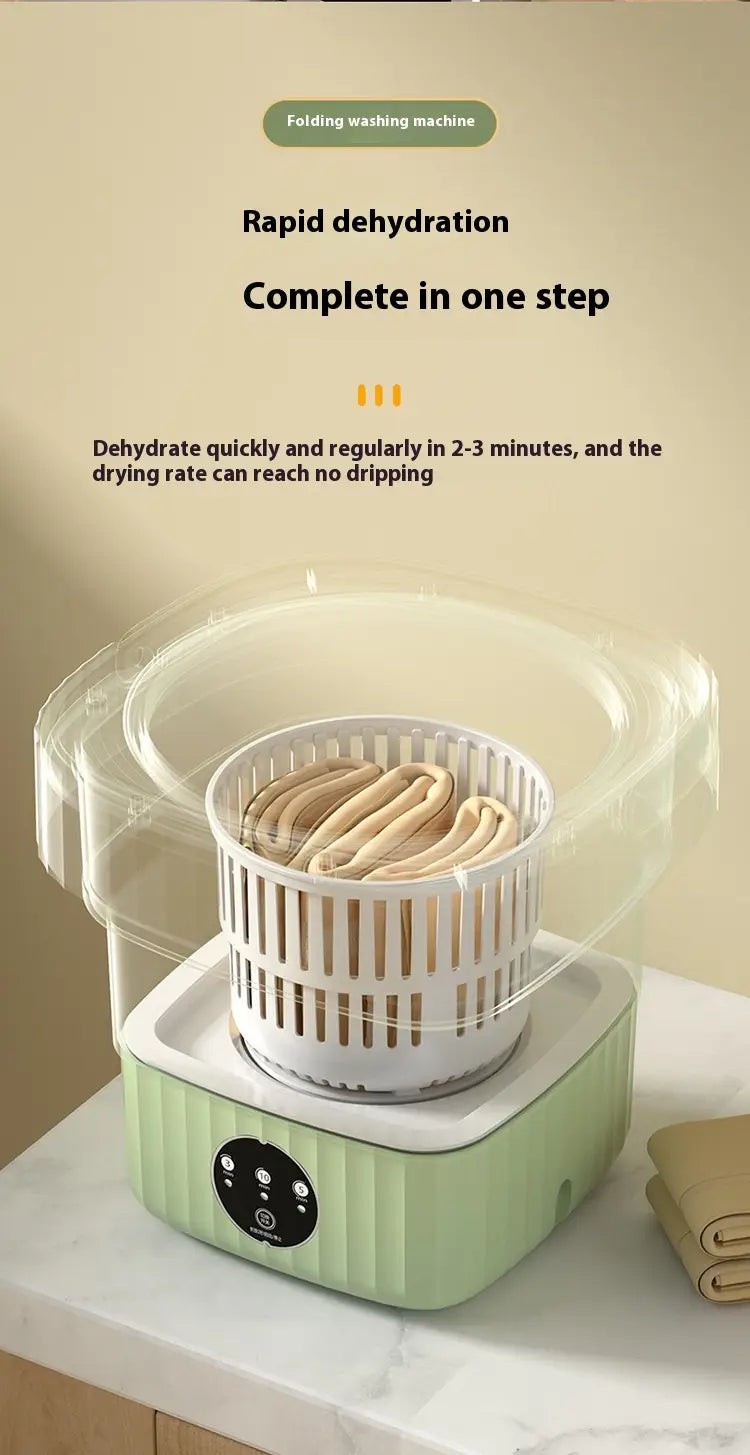 Mint green ribbed folding washing machine with a white perforated basket and transparent lid designed for rapid dehydration in 2 to 3 minutes.