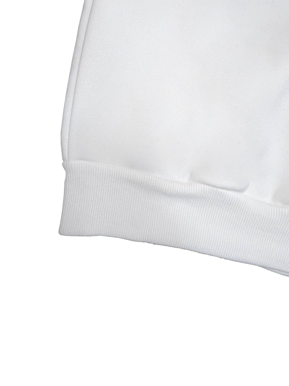 white ribbed knit cuff detail on a black leopard number 14 crew neck sweatshirt highlighting the crew neck sweatshirt design and material quality
