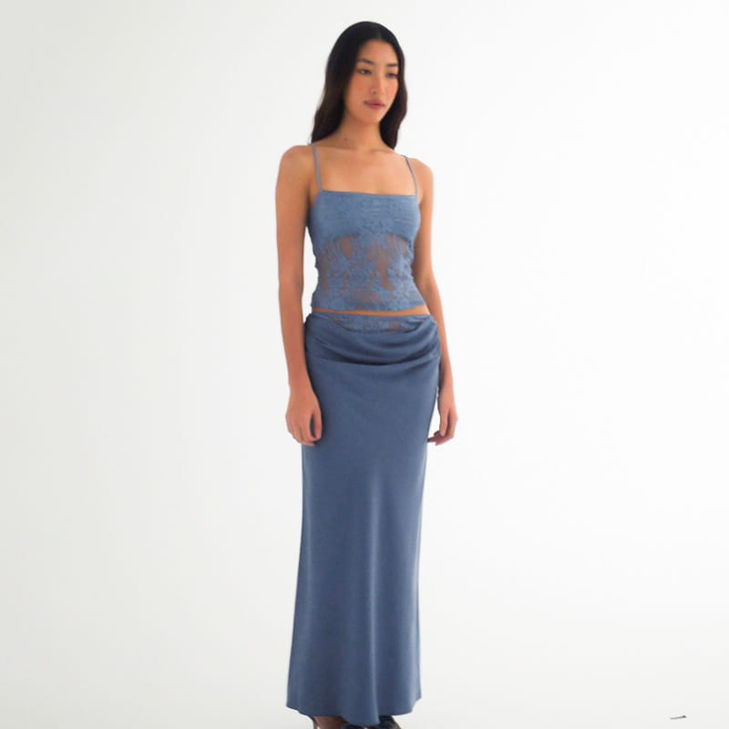 blue sheer lace top with matching flowing skirt featuring lace backless tube and sling stitching ruffle hip details in a sage green lace backless tube stitching ruffle hip suit