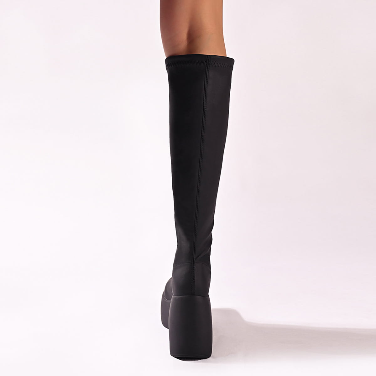 Black knee-high platform elastic leather boots with a sleek stretchy fabric upper and a thick block heel