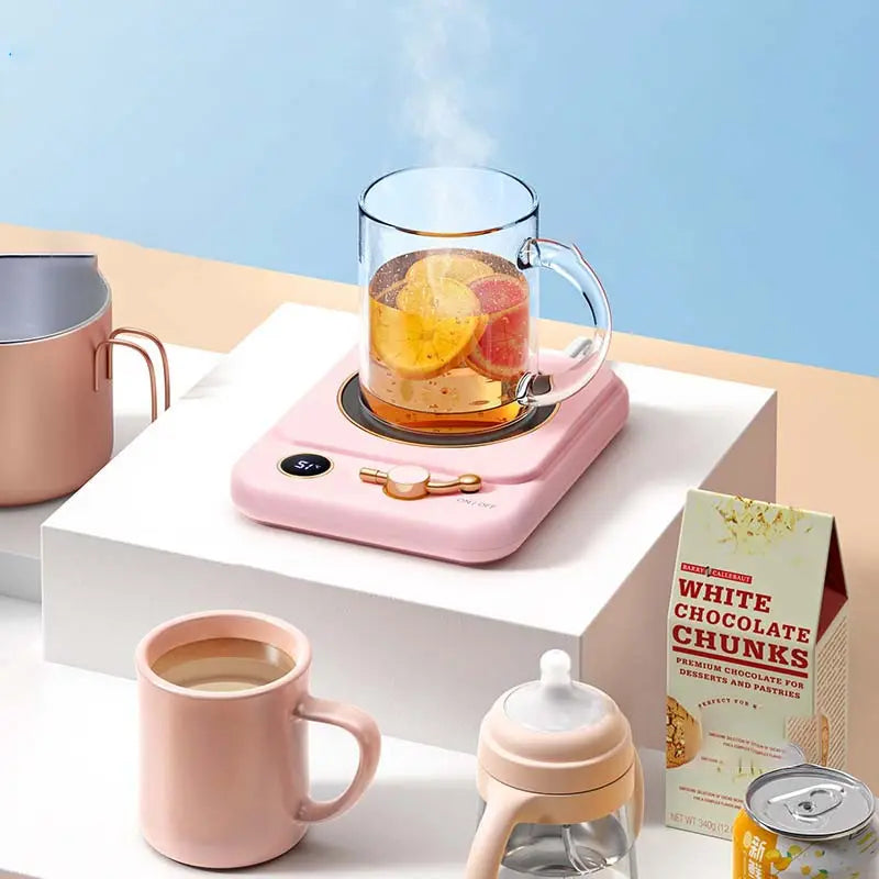 Pink electric milk heating insulation base desktop with digital display and rose gold accents for mug warming and temperature control.