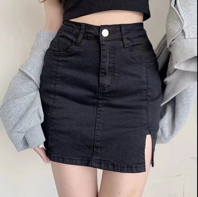 black denim skirt with a high waist front slit and white button closure made from distressed black denim