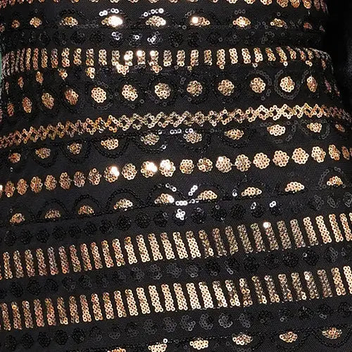 black and gold sequined lace trim with intricate patterns on a black lace long sleeve round neck sequined maxi dress