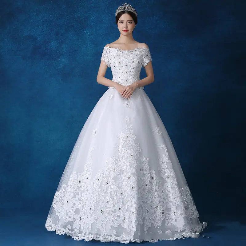 white off-the-shoulder wedding gown with intricate lace detailing and beaded embellishments made of main fabric by qidi studio wholesale.
