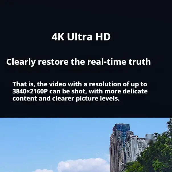 a modern high-rise building with glass and steel facades under a clear blue sky illustrating the environment for a 4k night vision driving recorder with panoramic parking surveillance use