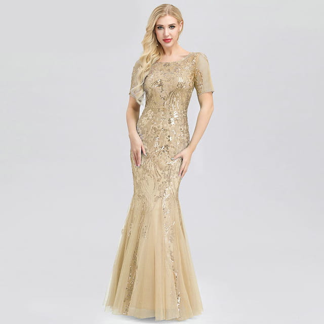 a shimmering gold sequined temperament mermaid dress featuring short flutter sleeves and a sheer overlay