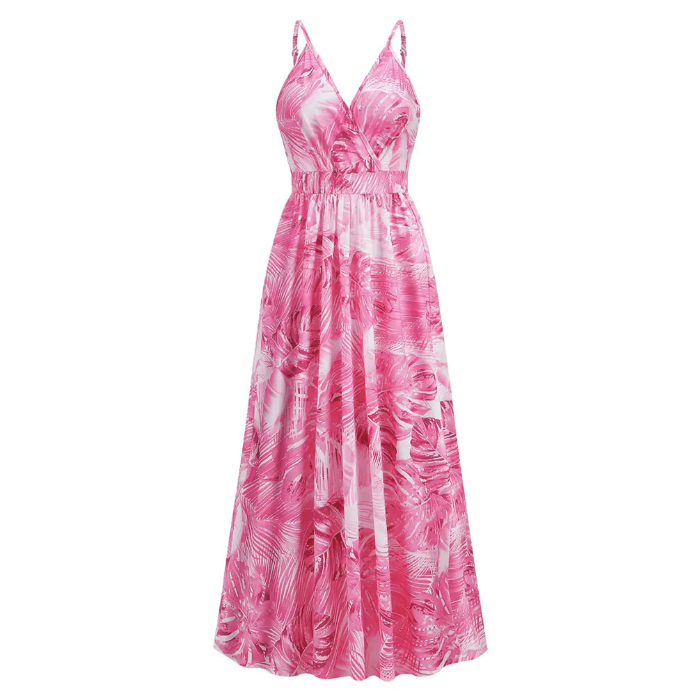 A flowing pink and white tropical leaf print flowers long dress summer with thin spaghetti straps designed as a dress summer swing.