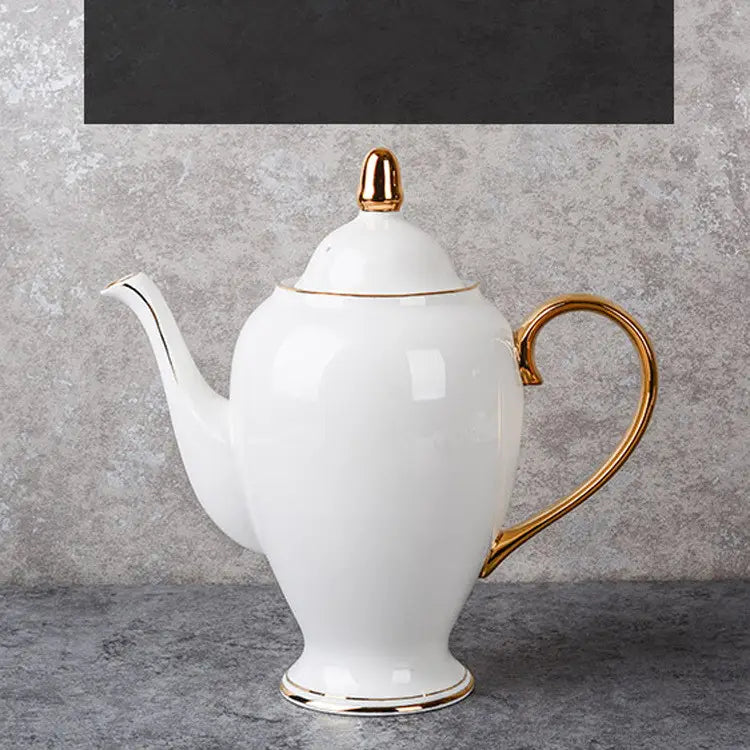 Elegant white bone china coffee pot with gold-trimmed handle spout lid knob and base as part of a coffee cup and saucer afternoon tea set.