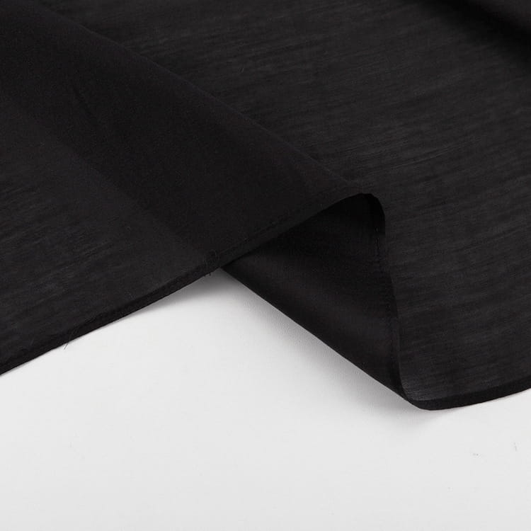 black sheer high waist slit sheath skirt made of black linen fabric with a subtle textured weave showing the front waist slit sheath design