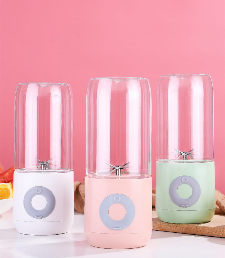 three usb automatic mini portable blender cups with clear glass tops pastel-colored bases in white pink and mint green and circular control panels for making fresh juice