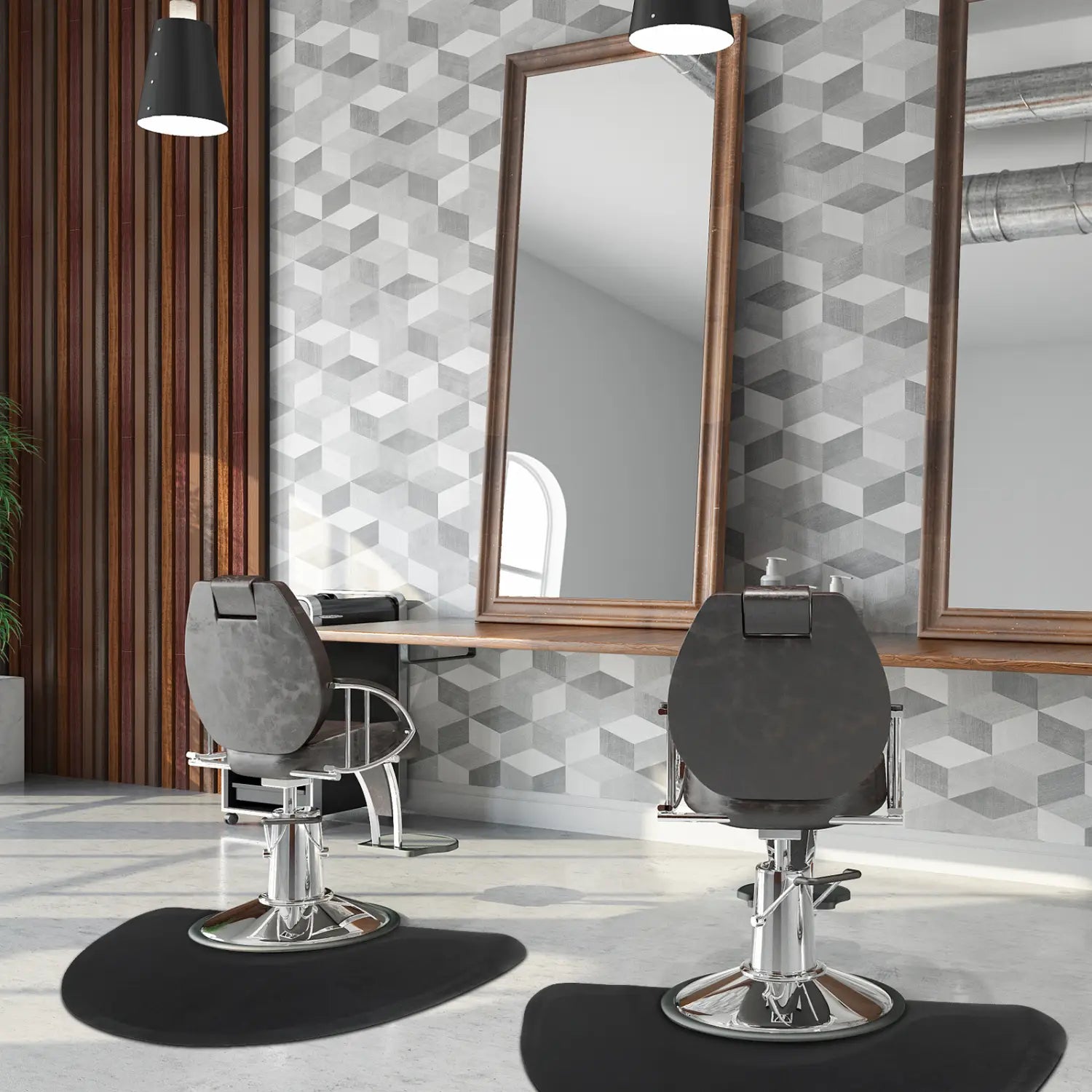 black leather barber chairs with chrome bases positioned on an outer circle black salon mat beneath wooden-framed mirrors in a salon setting