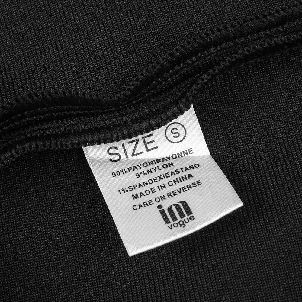 black backless bandage gown showing the care label of a knit fabric made of 90 percent polyester 9 percent nylon and 1 percent spandex highlighting the bandage chest white floral design