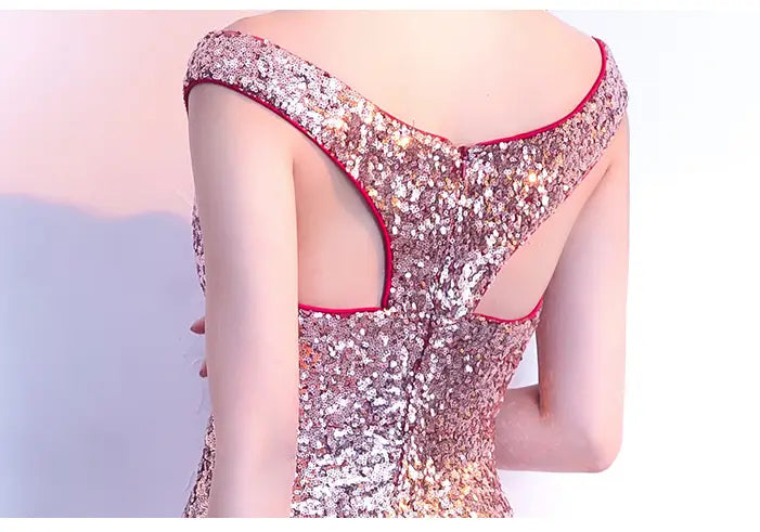 A shimmering rose gold sequined long slim fit gown with a deep back cutout and red trim designed as a slim fit fashion host dress.