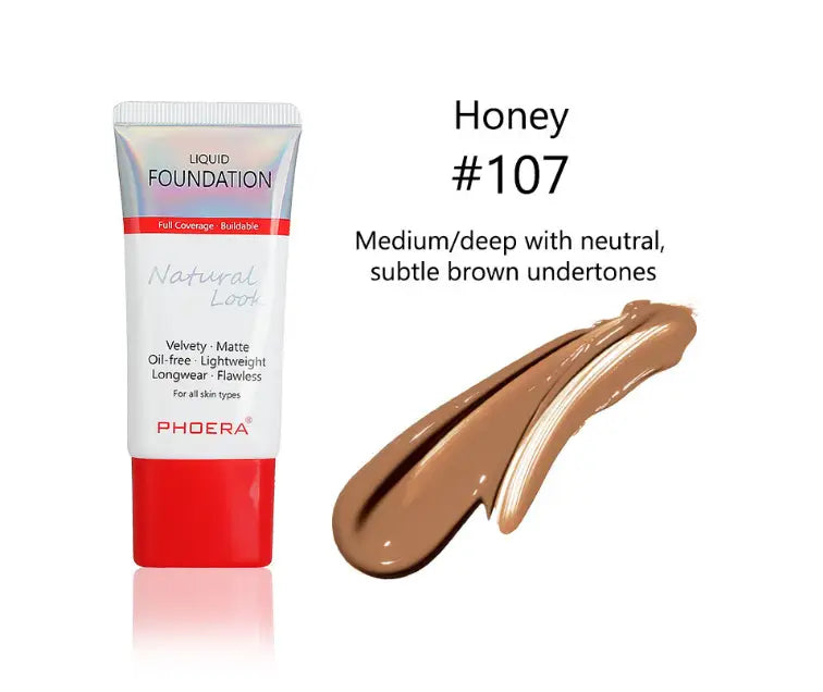 Phoeera tube liquid foundation in honey 107 is a medium deep shade with neutral undertones presented in a sleek tube with a red cap and iridescent silver label from the porcelain 101 matte silky collection.