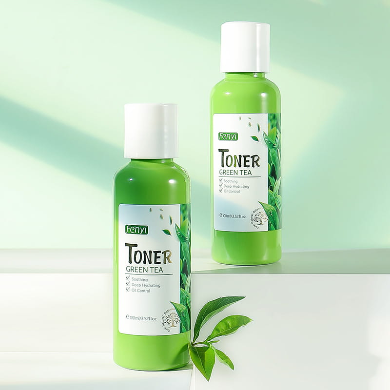two green glass bottles of fenyi hydrating green tea toner 100ml skin care lotion with white caps and leaf design labels for a refreshing green tea toner experience