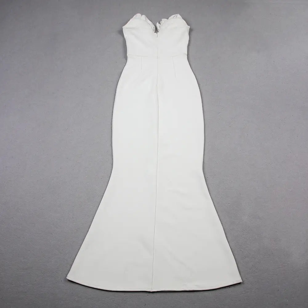 a sleek white mermaid-style gown with a fitted bodice and flared skirt in the style temperament socialite flower chain evening dress collection