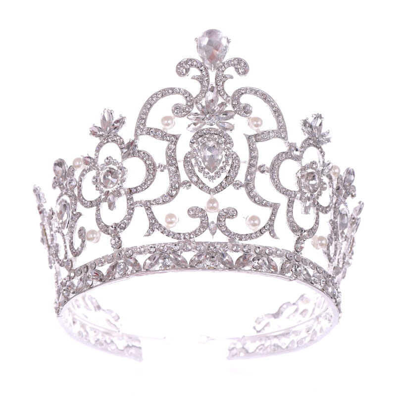 A sparkling silver crystal crown catwalk tiara adorned with clear crystals, pearls, and intricate floral designs.