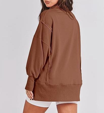 brown solid oversized sweatshirt crew neck with relaxed fit and ribbed cuffs shown from front in product titled pink solid oversized sweatshirt with side zippers