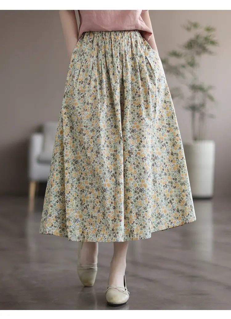 artistic floral washed a-line midi skirt in soft cream washed cotton sweet fabric featuring delicate yellow and muted green floral patterns