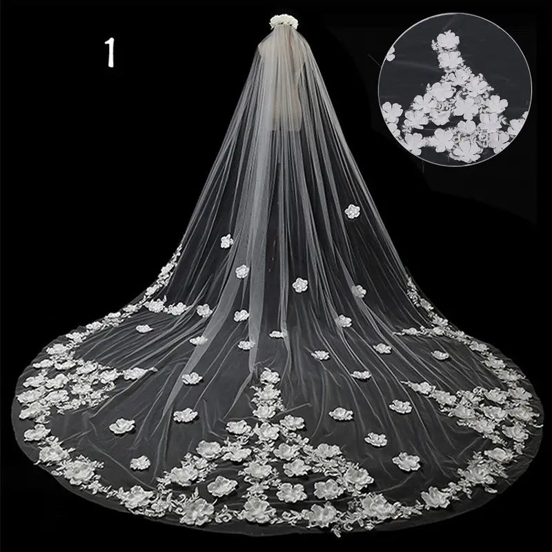 a delicate white lace wedding veil with intricate floral appliqués along its edge and cascading length in a long lace meters wide style