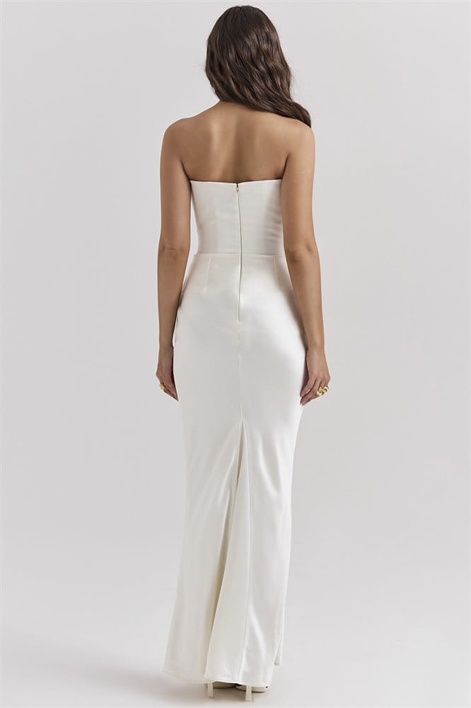 A sleek white satin strapless long dress sexy fashion gown with a fitted bodice and flowing skirt featuring a sexy fashion bandeau design.
