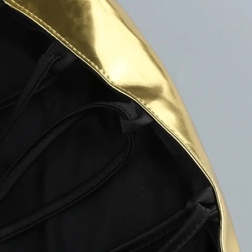 one-shoulder slit mop black dress two-piece set featuring a gold metallic exterior with black interior lining and set sexy lacing details