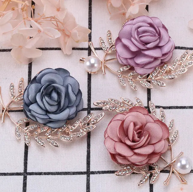 elegant fabric flower lady temperamental pin brooch set featuring rose-shaped satin petals in soft lavender gray and blush pink with rhinestone-embellished gold-toned leaves and pearl details