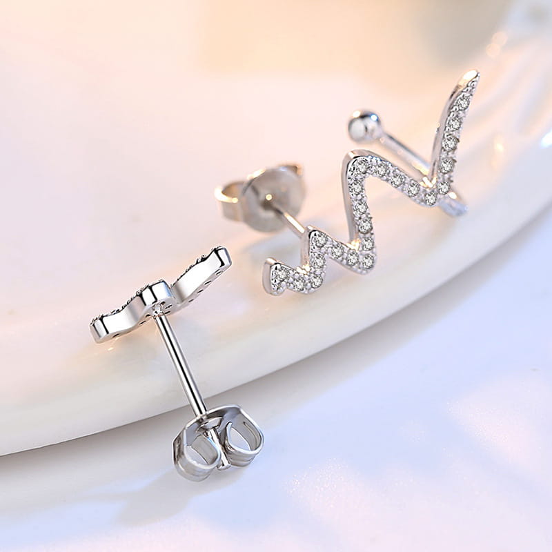 silver zigzag earrings adorned with sparkling clear crystals complement the silver heartbeat korean lightning necklace for a cohesive korean lightning necklace set