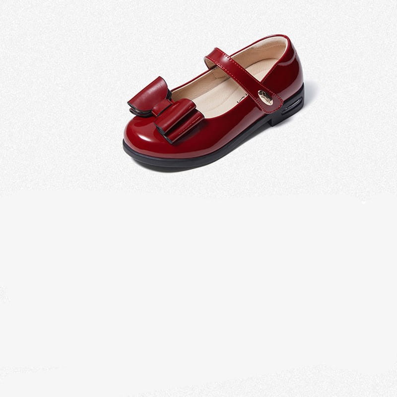 A glossy red patent leather girl shoes princess mary jane shoe with a black strap and bow.