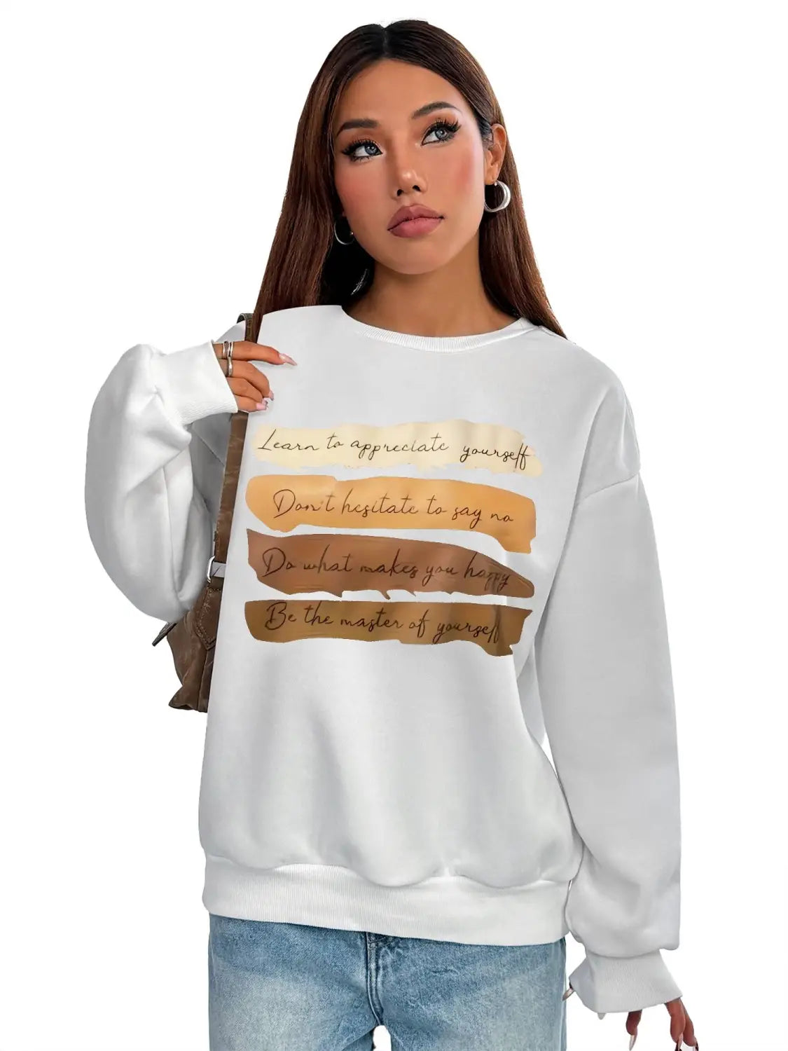 White oversized long sleeve sweatshirt featuring a motivational quote printed in brown cursive text on horizontal tan and beige stripes ideal for daily wear solid colour comfort.