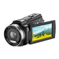 Black 5k digital camcorder with silver lens ring and flip-out lcd displaying scenic mountain for 48mp outdoor sports use